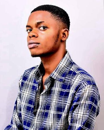 Gbolagade Winner, founder of JAMBUDDY, in a blue checked shirt